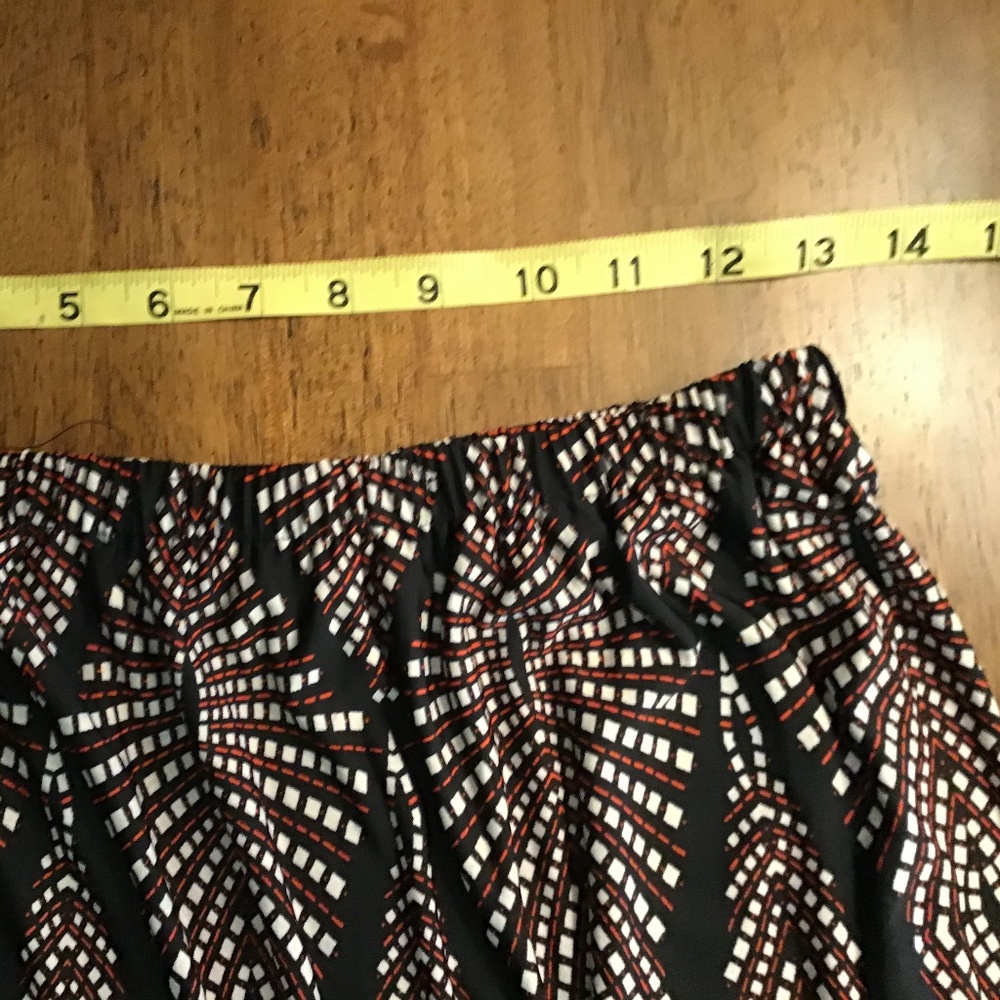 Print a multi color skirt black red and white.